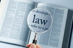 Lesser-known NJ laws can lead to criminal charges; magnifying glass used to highlight 'law'